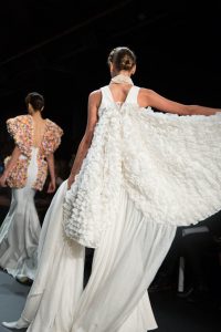 A winged model walking the runway during the John Paul Ataker NYFW collection