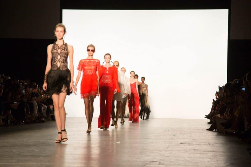 Models on the runway of Tadashi Shoji's NYFW show. Photo by JULEIMAGES.