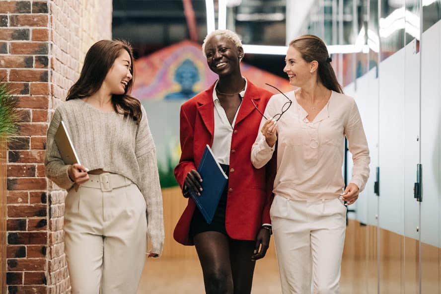 Photo by Alexander Suhorucov: https://www.pexels.com/photo/diverse-successful-businesswomen-smiling-and-walking-together-in-modern-workplace-6457562/