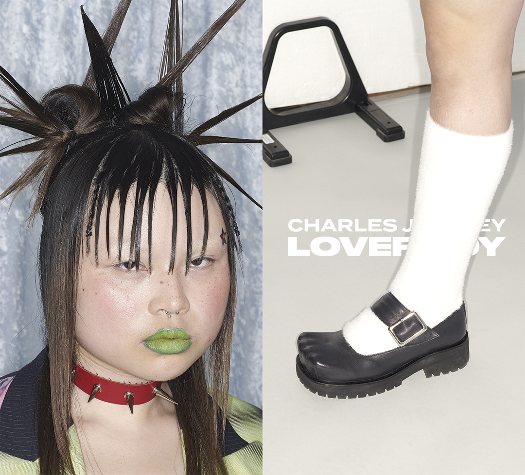 Model wearing green lipstick, spiky hair, white socks and black shoes.