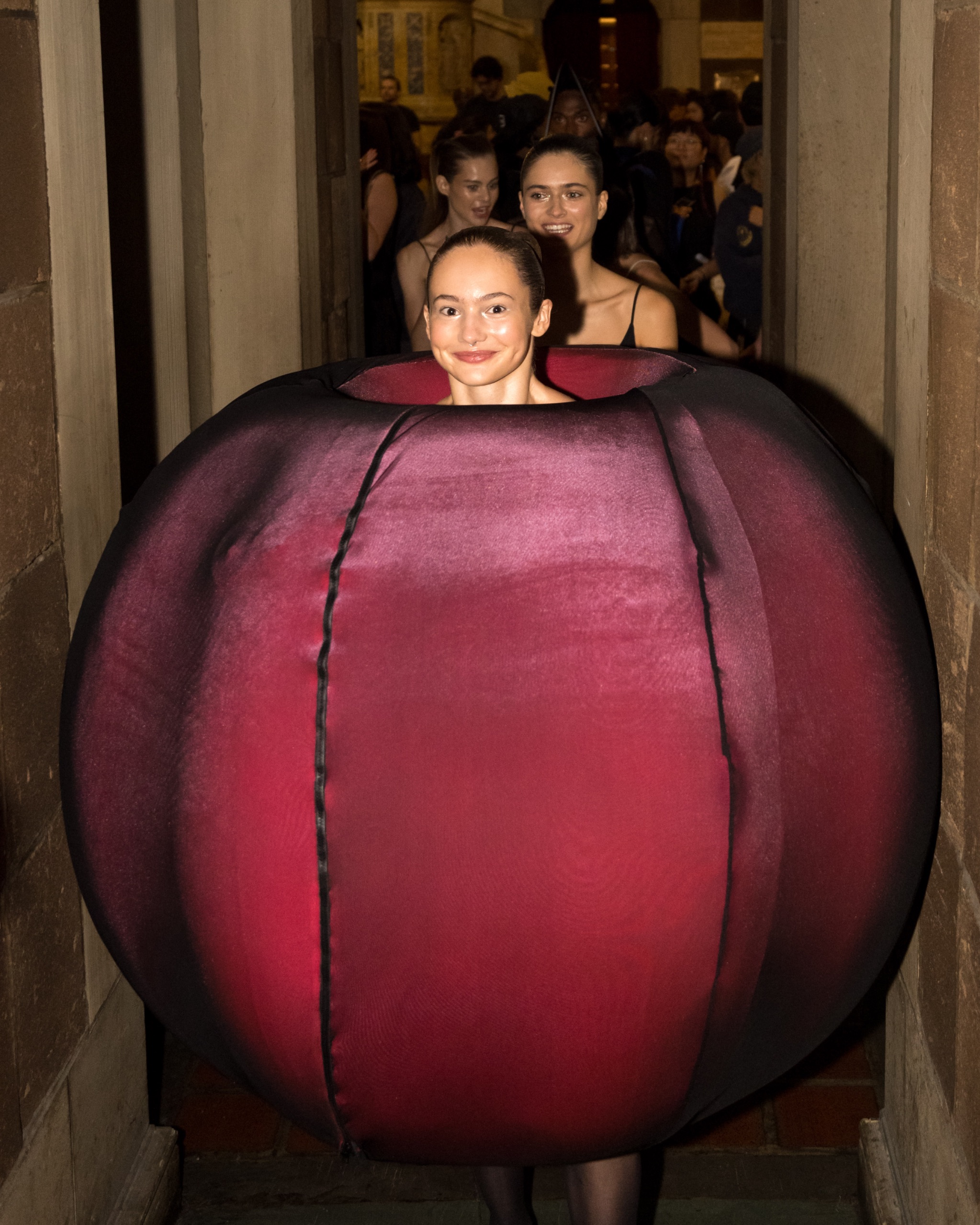 Model wearing oversized pink clothing pie