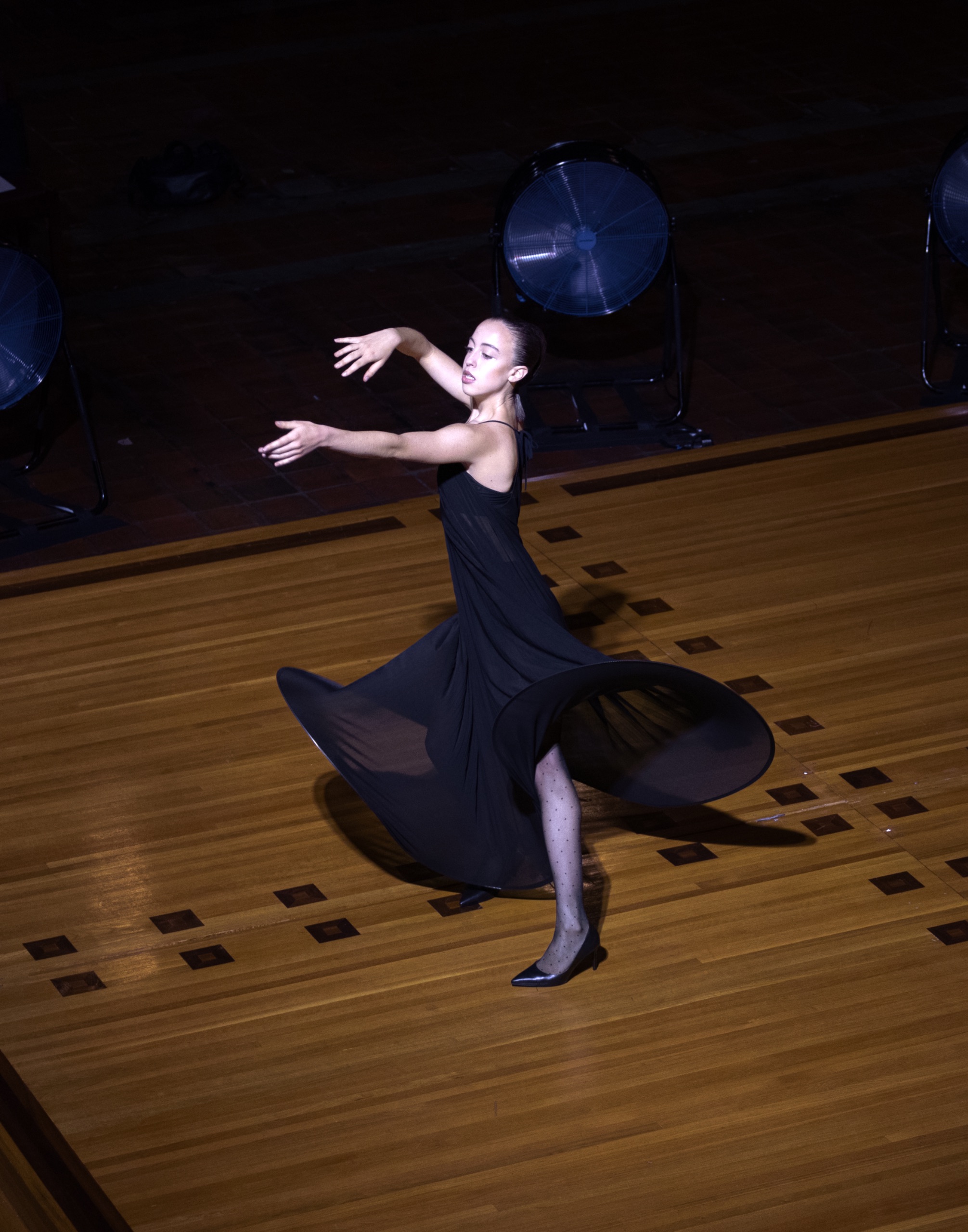 A model wearing a black dress.