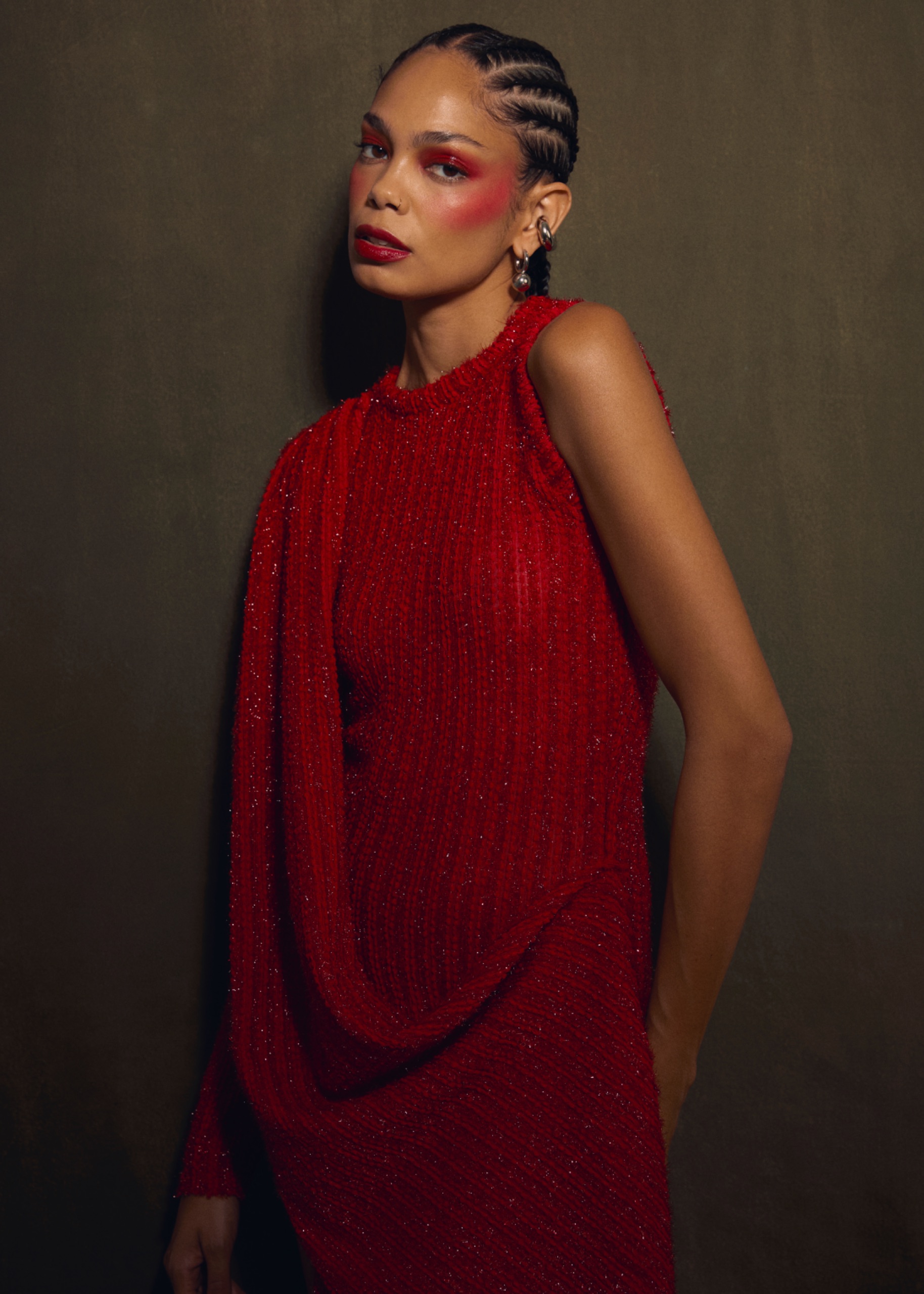 A model wearing a long red dress.