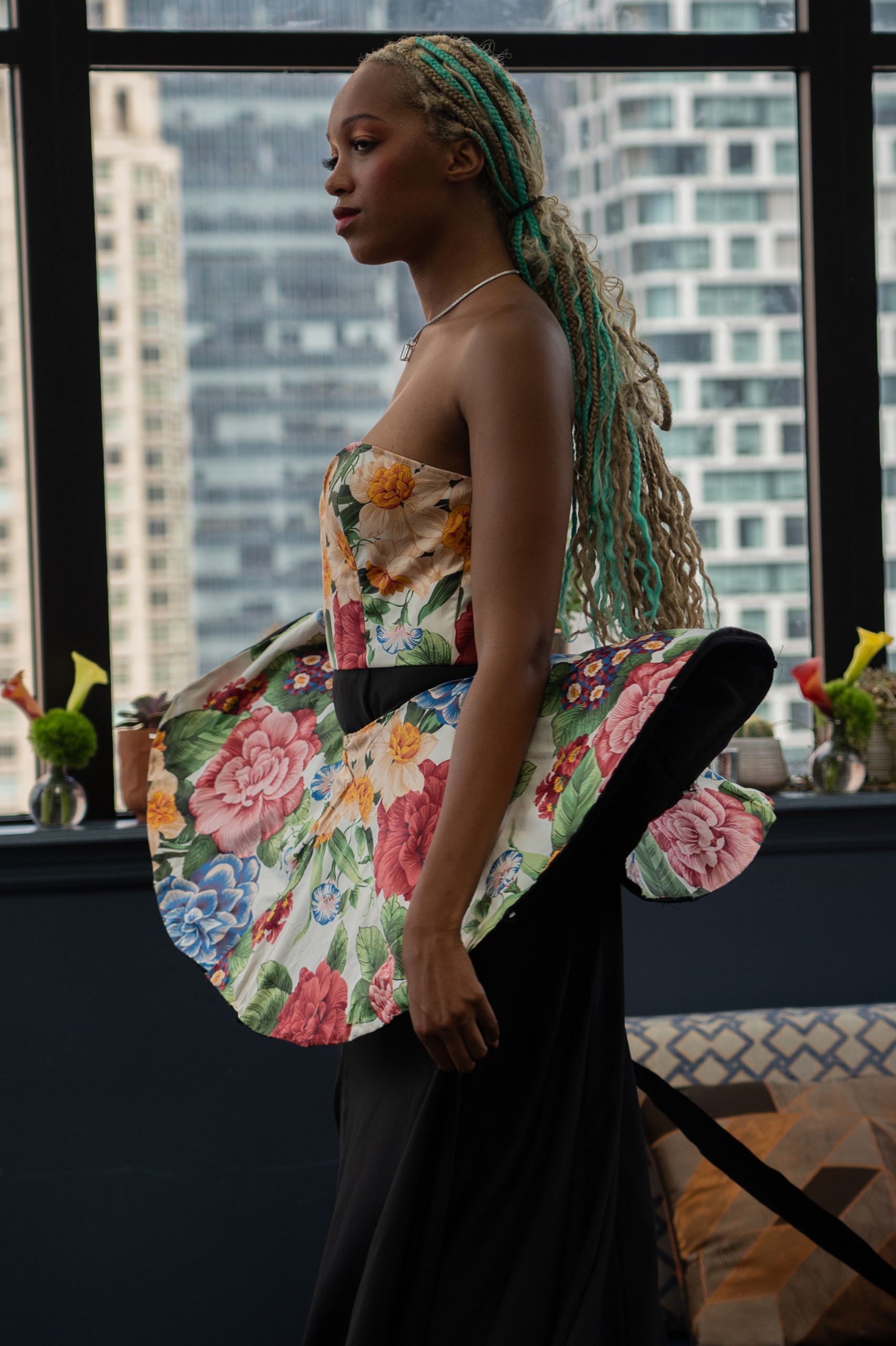 A model wearing a floral dress.