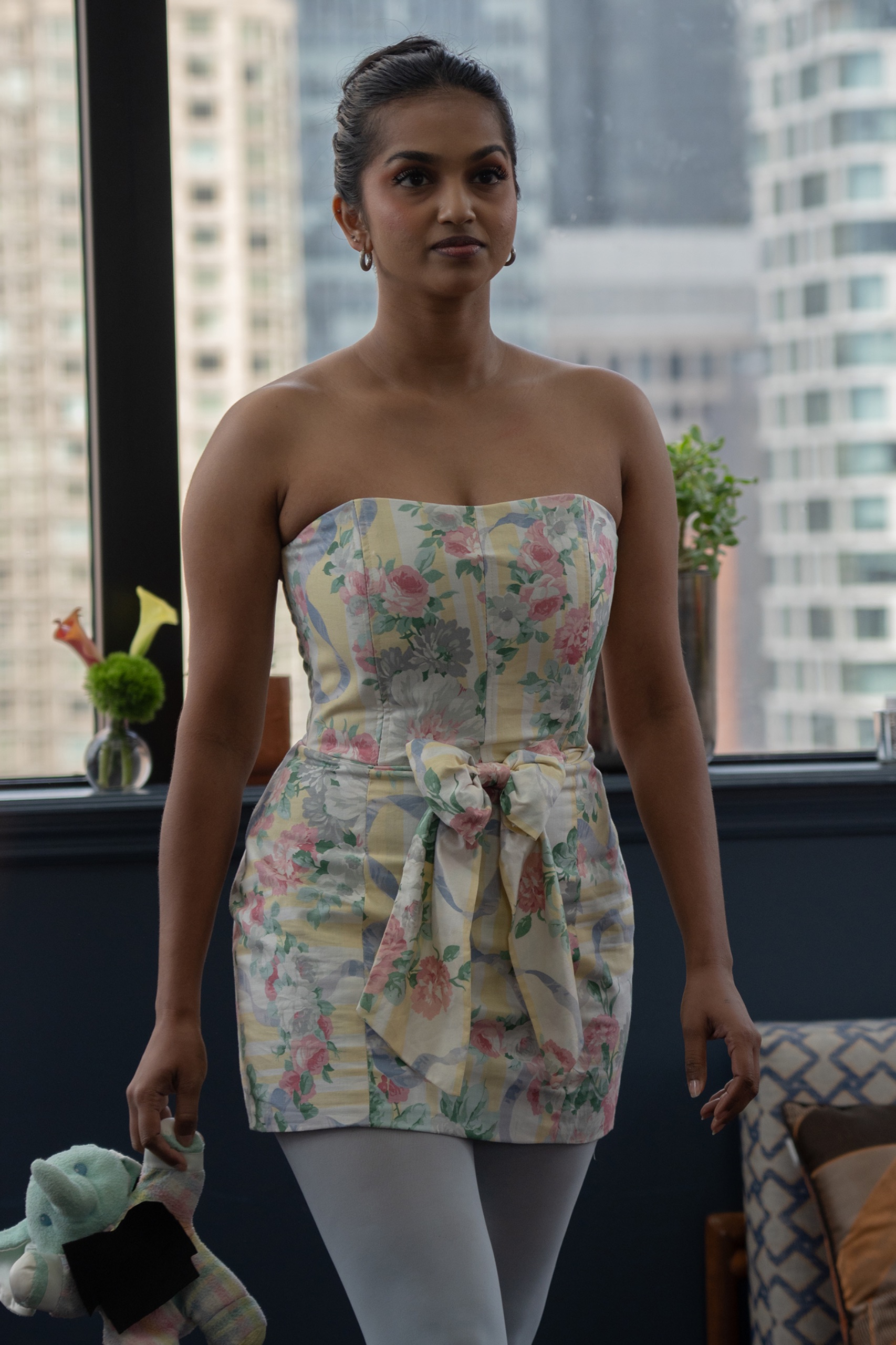 A model wearing a floral dress.